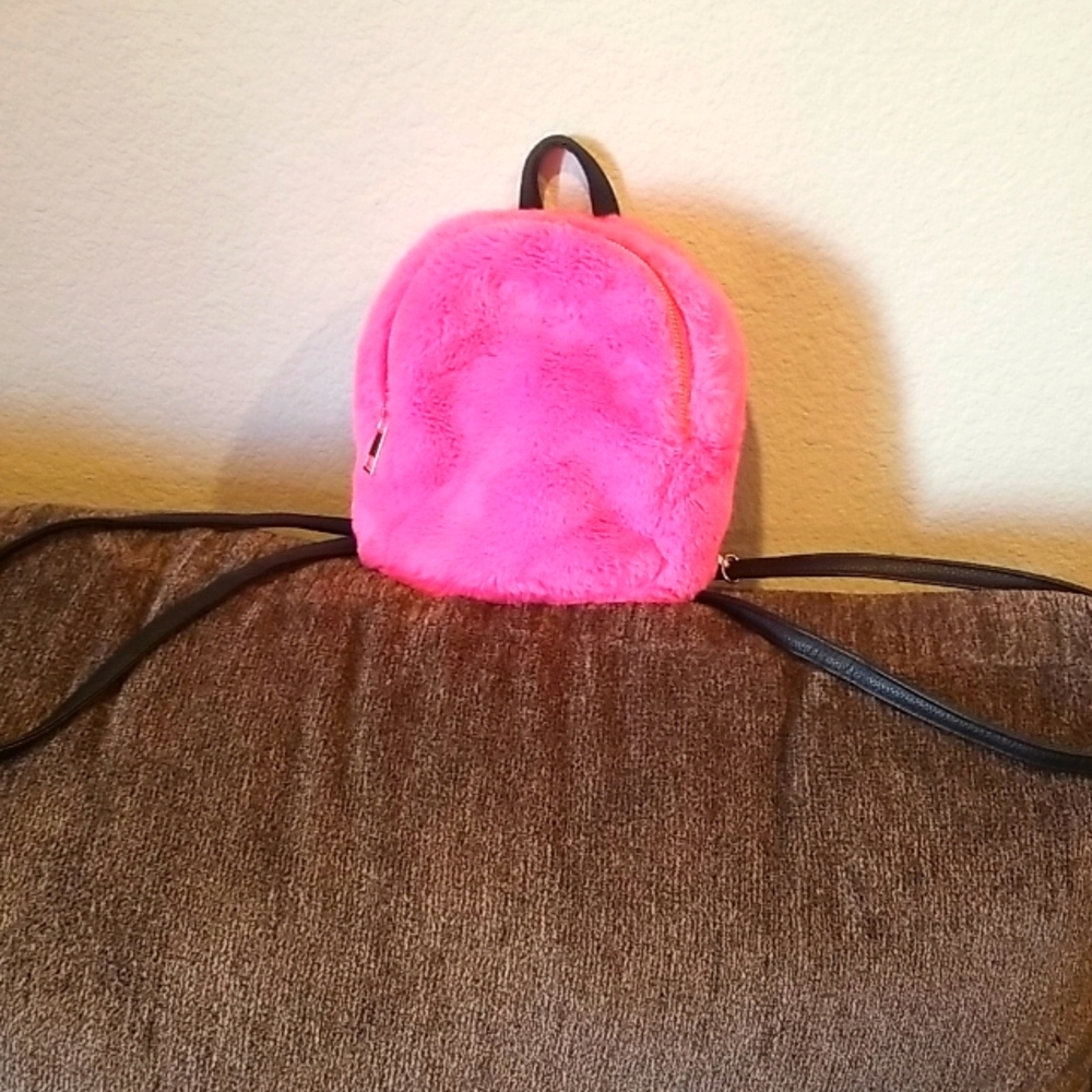 Barbie Pink fur small Backpack with black straps and gold finished hardware.